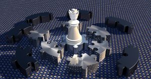 チェスの駒の周囲を囲むパズルのピース